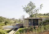 A bamboo enclosure creates a dialogue between the interior and the dramatically changing landscape.