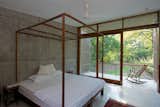 Bedroom, Concrete Floor, and Bed The Guest Bedroom  Photo 9 of 17 in House on a Stream by Architecture BRIO