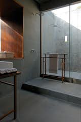 Bath Room, Open Shower, Stone Slab Wall, Vessel Sink, Wood Counter, and Limestone Floor The Master Bathroom  Photo 11 of 17 in House on a Stream by Architecture BRIO