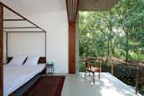Master bedroom with a balcony hovering over the stream