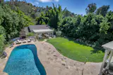 The Beverly Hills property of American film producer and co-founder of Orion Pictures Mike Medavoy and philanthropist Irena Medavoy listed by Coldwell Banker Residential Brokerage for $5,495,000. 
