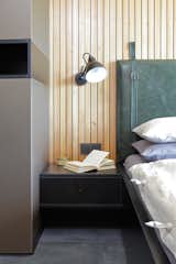 detail of custom designed headboard made from green vintage leather