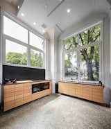 Kitchen, Wood Cabinet, Wall Oven, Cooktops, Concrete Floor, and Engineered Quartz Counter  Photo 3 of 6 in Park Ave Live Work by YBA Architects
