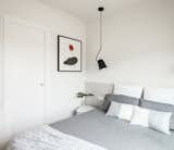 Double bedroom in white and grey colors