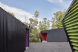 Exterior, Metal Siding Material, Metal Roof Material, House Building Type, and Shed RoofLine Colour accents in automotive paint provide accents and identity to each structure.  Photos from The Black Wedge House