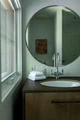 Bath Room, One Piece Toilet, Ceiling Lighting, Drop In Sink, Enclosed Shower, Stone Counter, and Medium Hardwood Floor Bathroom Vanity (Second Floor)  Photo 14 of 31 in Wayfarer Treehouse by Hygge Stay