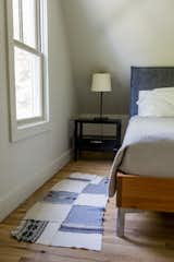 Bedroom, Light Hardwood Floor, Ceiling Lighting, Table Lighting, Chair, Bed, and Storage Second upstairs bedroom  Photo 14 of 20 in Modern Farmhouse by Hygge Stay