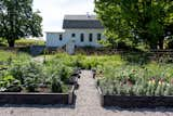 Outdoor, Raised Planters, Trees, Vegetables, Horizontal Fences, Wall, Gardens, Flowers, Garden, and Walkways Exterior from the gardens  Photo 16 of 20 in Modern Farmhouse by Hygge Stay