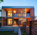Exterior, House Building Type, Green Siding Material, Wood Siding Material, and Flat RoofLine Garden View at Dusk  Photos from The GenY House