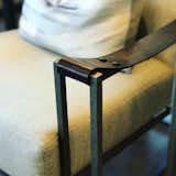 That leather strap for an armrest is a brilliant touch.