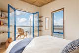Bedroom, Chair, Bed, and Light Hardwood Floor  Photo 8 of 8 in Picnic Island, Tasmania, Australia. by clem newton-brown