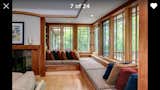 Custom-made bench-seating in living room, overlooking wooded back lot. 