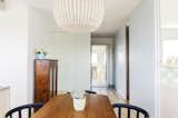Dining Room, Chair, Table, Light Hardwood Floor, and Ceiling Lighting  Photo 5 of 12 in Apartment with a view by Atelier Starzak Strebicki