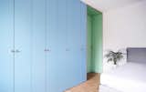 Bedroom, Bed, Wardrobe, Ceiling Lighting, and Medium Hardwood Floor The wardrobe  Photo 6 of 18 in Apartment Jacko II, Refurbishment of an apartment from the '50s by Atelier Starzak Strebicki