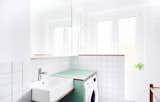 Bath Room, Laminate Counter, Open Shower, Wood Counter, Ceramic Tile Wall, and Ceiling Lighting Bathroom with the view of the washbasin  Photo 14 of 18 in Apartment Jacko II, Refurbishment of an apartment from the '50s by Atelier Starzak Strebicki