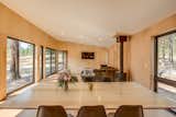 The centrally located living space is flanked by bedrooms on either end of the house's volume. Windows on all 4 sides allow unobstructed views of the surrounding landscape.
