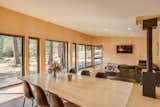 Wall to wall glass frames the landscape.