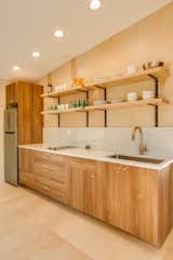 Floating shelves keep h kitchen open and airy.