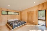 Wood paneling embraces you while large windows are always expanding the view outward.