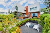 The two upper volumes extend towards the view, carving space below to create an intimate courtyard-deck that connects the inside to outside efforlessly.