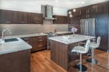 the functional kitchen opens to the living spaces harmonizing the graceful open plan.