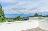 Rooftop decks above the main volumes of the house provide additional outdoor space for entertaining or simply catching some rays while taking in the views.