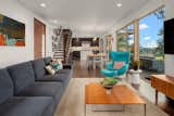 Open concept of living room and kitchen reflected by the view.