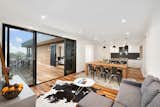 Living 

The two living areas sit side-by-side in the middle of the home, with large windows and direct access to the deck. 

The 2.7m ceilings and 2.34m internal door heights create a sense of space throughout the entire home. The house features double-glazed windows throughout (a standard inclusion) and energy-saving LEDs in the main rooms. 

The kitchen includes a large walk-in pantry, Caesarstone benchtops with waterfall ends and a 900mm freestanding Smeg cooker.