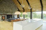 Living areas possess 8-ft by 8-ft sliding glass doors which open onto decks delivering 180 degree vistas. 