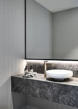 Bath Room, Marble Counter, Ceiling Lighting, Accent Lighting, Light Hardwood Floor, Vessel Sink, and Pendant Lighting Canny 'The New' Powder Room  Photos from The New