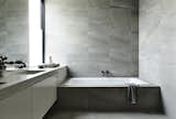 Bath Room, Drop In Tub, Porcelain Tile Floor, Porcelain Tile Wall, and Stone Counter Canny 'The New' Bathroom  Photos from The New