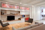Living room area with client's artwork  incorporated and can be enclosed with sliding panels 