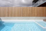 Outdoor, Concrete Fences, Wall, Swimming Pools, Tubs, Shower, Concrete Pools, Tubs, Shower, Wood Fences, Wall, Vertical Fences, Wall, Side Yard, and Wood Patio, Porch, Deck  Photos from Morell House