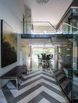 Hallway featuring large windows allowing for natural lighting in the dining room