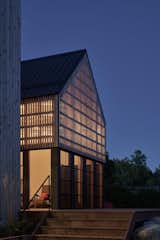Exterior, Metal Roof Material, Gable RoofLine, House Building Type, and Wood Siding Material The Monocular - Screened-in Porch at Dawn  Photo 6 of 51 in The Monocular by RHAD Architects