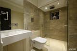 Bath Room, Recessed Lighting, Marble Counter, Marble Wall, One Piece Toilet, Enclosed Shower, and Marble Floor  Photo 7 of 12 in Luxury Residence in Mumbai by Evolve