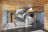 Monumental sculptural stair of stainless steel and white oak