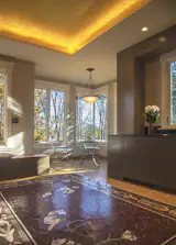 The focal point of the kitchen is the custom-design Italian mosaic marble floor which incorporates themes from elsewhere in the home, and is capped by a hand-painted golden coved ceiling.