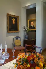 The dining experience is a family affair, surrounded by inherited paintings of family ancestors.