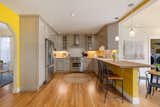 Kitchen, Cooktops, Recessed Lighting, Refrigerator, Range, Pendant Lighting, Wood Counter, Medium Hardwood Floor, and Accent Lighting chef's kitchen  Photo 7 of 32 in Big, Bold and Beautiful by Cherie Carson