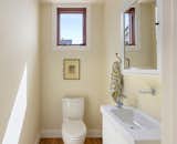 Bath Room, One Piece Toilet, and Medium Hardwood Floor 1/2 bath on main level  Photo 15 of 32 in Big, Bold and Beautiful by Cherie Carson