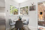 Eat-in-kitchen, breakfast nook opens to side patio and gardens