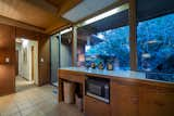 Kitchen, Recessed Lighting, Ceramic Tile Floor, Wood Cabinet, Microwave, Tile Counter, and Cooktops  Photo 15 of 54 in Robin Gay McCline residence by Nader Assemi