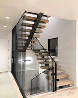 Staircase, Metal Railing, and Wood Tread Main Staircase  Photo 19 of 22 in Model Home 2 by Aaron Oldham