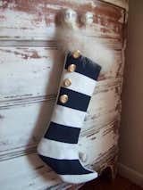 There's no way Santa will miss this eye-catching modern Christmas stocking. With trendy, black-and-white stripes and gold details, it's sure to be a lovely addition to your modern Christmas decor.