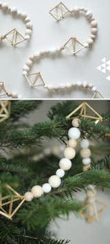 Natural wood makes a perfect choice for modern Christmas tree decorations, like the simple wooden garland seen here. Geometric shapes add a touch of visual interest to the strands of wooden beads. Pair this with your favorite modern Christmas ornaments, or let it adorn your tree by itself for the perfect minimalist look.