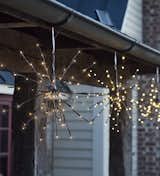 Adorn your rafters with these radiant bursts of light if you're looking for modern Christmas outdoor decor. Tiny twinkling lights are understated and elegant, making your space look elegant rather than overdone.