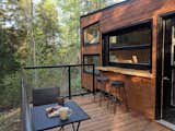 In the warmer months, the window can be raised to allow those on the deck and inside the cabin to chat face-to-face.