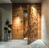 The entry door is made up of wooden with Veneer Finish and Name plate in Metal which is mesmerize eye catching to an every visitor .