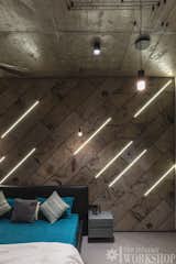 In Children Room Stone Sheet is used in bed back. With Matt finish tiles in flooring, Exposed RCC ceiling along with vibia lights pattern.

